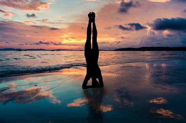 yoga stand in hands silhouette